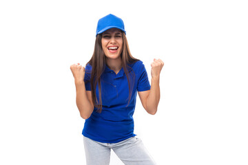 Fototapeta na wymiar active young caucasian brunette advertiser woman in blank blue t-shirt and cap for brand print