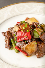 Hot and sour meat sauteed with red pepper, green pepper and onion. Asian cuisine