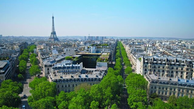 Pan footage of panoramic view of Paris from above. Aerial view of the Tour and buildings on a sunny day in France.