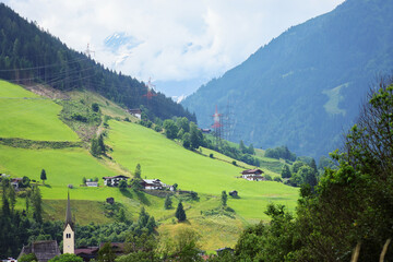 Fototapeta na wymiar Mountain village on the mountainside. Village in mountains 