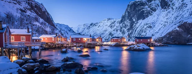 Fotobehang Amazing winter seascape. Nusfjord authentic fishing village with traditional red rorbu houses in winter during sunset. Lofoten islands, Norway. Typical north scenery of Lofoten islands. Norway © jenyateua