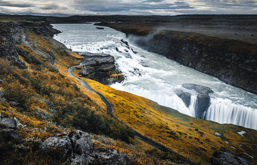 Amazing Nature landscape of Iceland. Impressively beautiful Gullfoss waterfall in canyon with colorful sky during sunset. Tipical Iceland scenery. Iconic location for photographers and bloggers