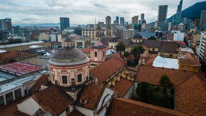 aerial established of Bogota Main square in historical downtown colonial cathedral and palace of...