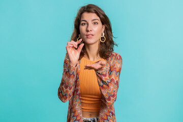 Need some more, please give me, help. Woman showing a little bit gesture with sceptic smile,...