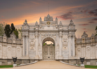 Fototapeta na wymiar Sunset shot of closed gate leading to former Ottoman Dolmabahce Palace, or Dolmabahce Sarayi, suited in Ciragan Street, Besiktas district, Istanbul, Turkey. View from the internal court