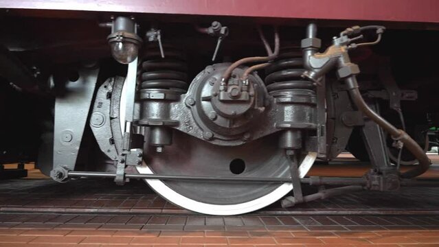 huge steel black locomotive wheels with lever syste