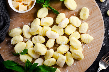 Gnocchi, Fresh Uncooked Potato Gnocchi on Wooden Board, Italian Cuisine