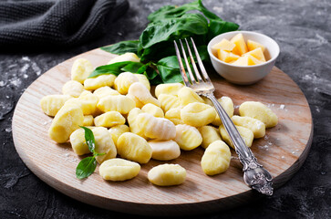 Gnocchi, Fresh Uncooked Potato Gnocchi on Wooden Board, Italian Cuisine
