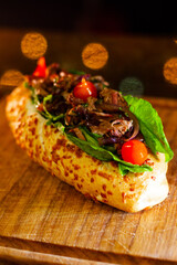 Delicious Pork Brisket Sandwich with Arugula and Piquillo on Parmesan Bread