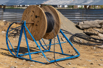 Wooden Coils Of Electric Cable Outdoor. High and low voltage cables in the storage. coils...
