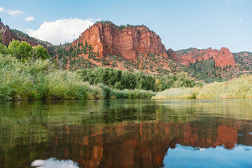 Blue sky behind Colorado Cliffs overlooking the lake