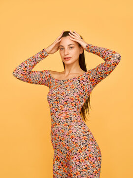 A young woman portrait over orange background