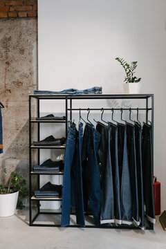 jeans hanging  in a row in a store