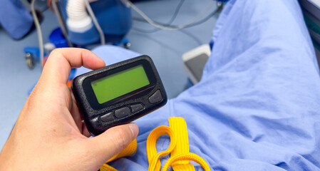 pager beeper lies on a desk, symbolizing instant communication and connection, bridging distances and enabling efficient messaging in the digital age