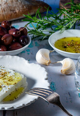 Feta cheese with olive oil, oregano and kalamata olives.