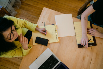 view from above of note taking during meeting 