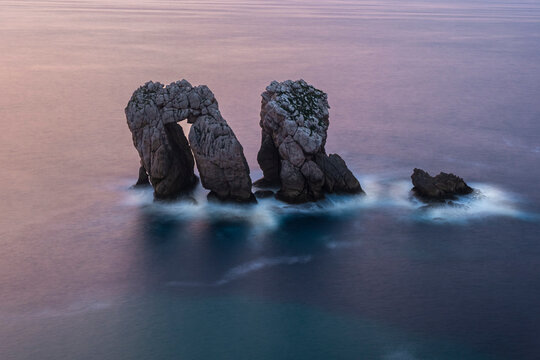 Urro del Manzano, sea stacks in Costa Quebrada at dusk, Cantabria, Spain