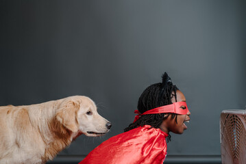 Superhero girl singing in a fan