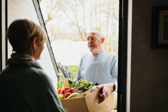 delivery of fresh fruits and vegetables at home of a senior