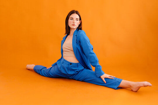 Flexible woman stretching in split