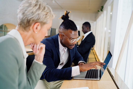 Colleagues working together in an office space