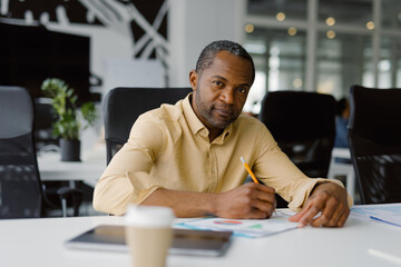 Busy employee paperwork documents modern workspace