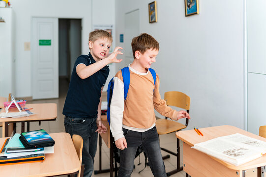 school boy playing at class room