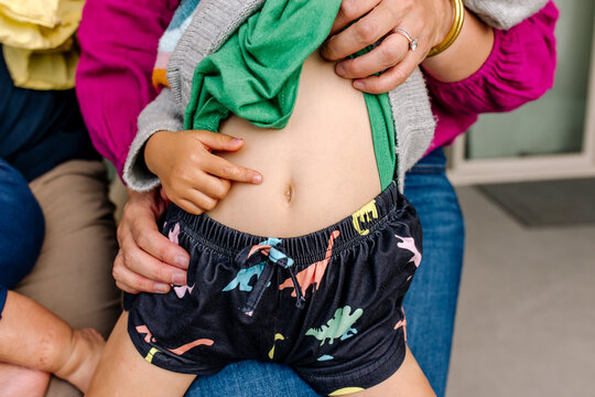 Close up of the belly of a cheeky little toddler girl