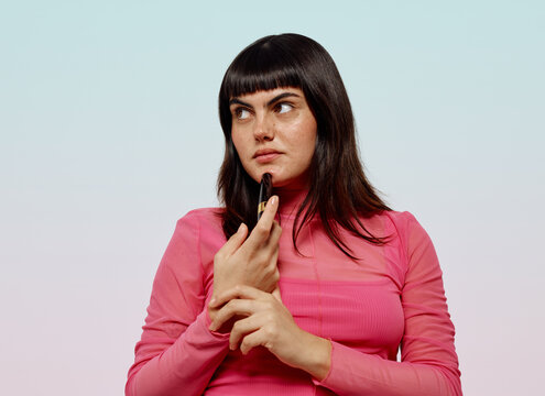 Woman doubtful about her make up product