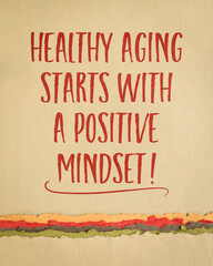 healthy aging starts with a positive mindset - inspirational note reminder on art paper, lifestyle and personal development concept