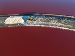 Salt farm excavator top view with salt hill