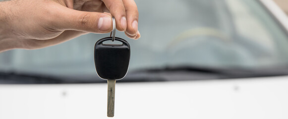 man hand key with car