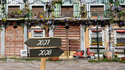 Obraz premium Signposts the direct way to 2028 versus 2027