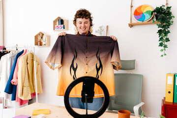 Happy non binary blogger advertising trendy shirt