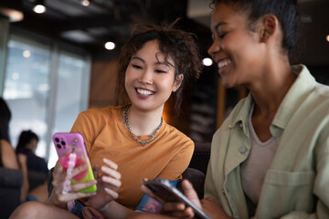 Friends enjoying social media together while in cafe