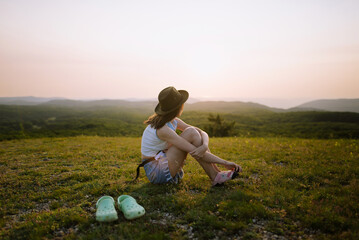 Anonymous Woman Admiring Mountains At Sunset