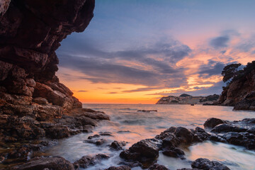Sunset seascape with rocky beach in Croatia