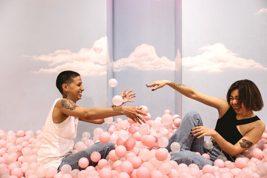 Lesbian couple in ball pool