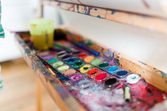 view of paints on an easel
