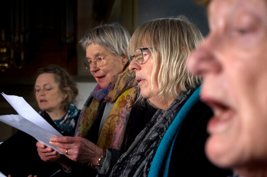 Women of choir practicing