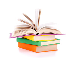 Composition with stack of books on a white background.