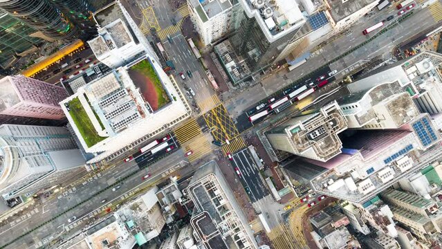 Hyperlapse Timelapse of car traffic transport on road junction intersection in Mong Kok, Hong Kong city downtown. Drone aerial top view. Asian people lifestyle, Asia city life or public transportation