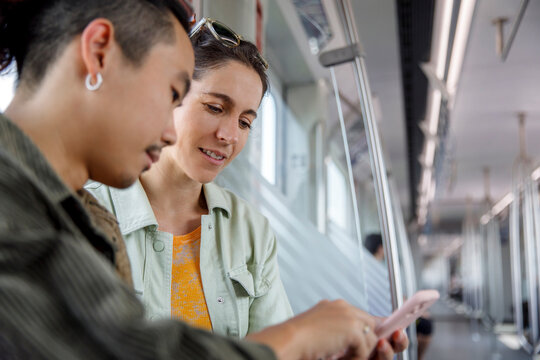Tourist receiving help on smartphone while on train