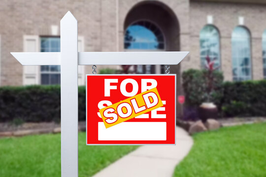 Sold Home For Sale Sign in Front of New House.