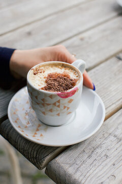 A cup of coffee wit lipstick mark on it 