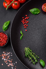 Ingredients for cooking cherry tomatoes, salt, spices and herbs