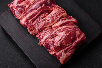 Fresh raw beef ribs with salt, spices and herbs