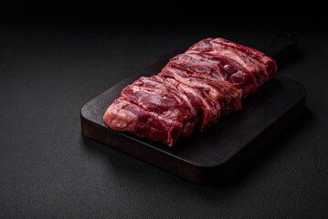 Fresh raw beef ribs with salt, spices and herbs