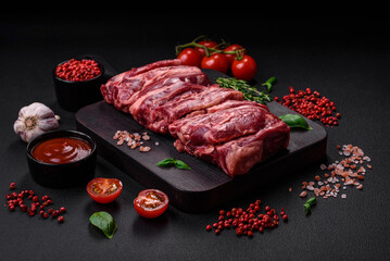 Fresh raw beef ribs with salt, spices and herbs