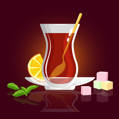 Glass with traditional turkish tea, Turkish delight, lemon slice and mint on dark background